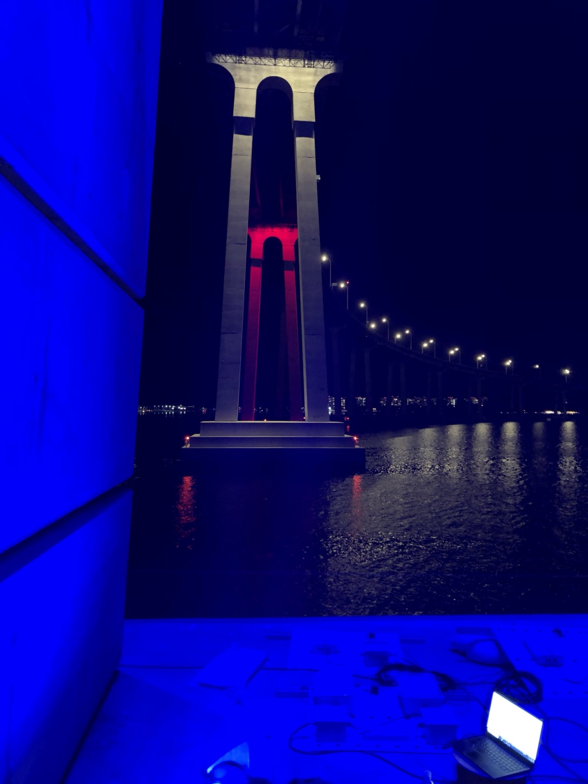 Coronado Bridge illuminated at night over San Diego Bay